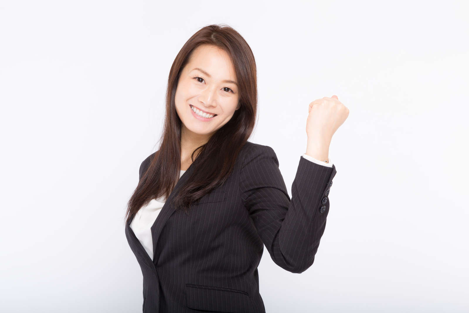 喜ぶスーツの女性